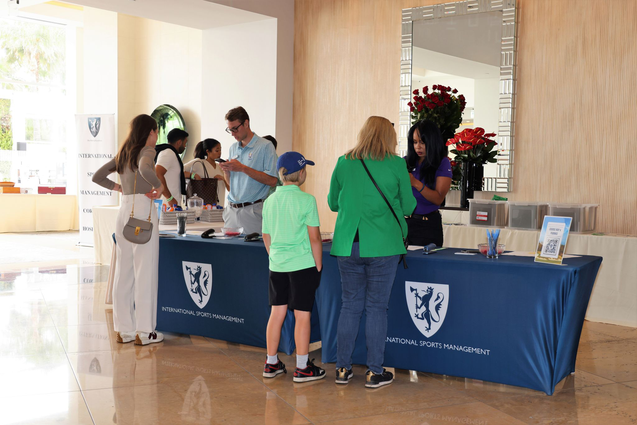 ISM team welcoming guests at a previous event