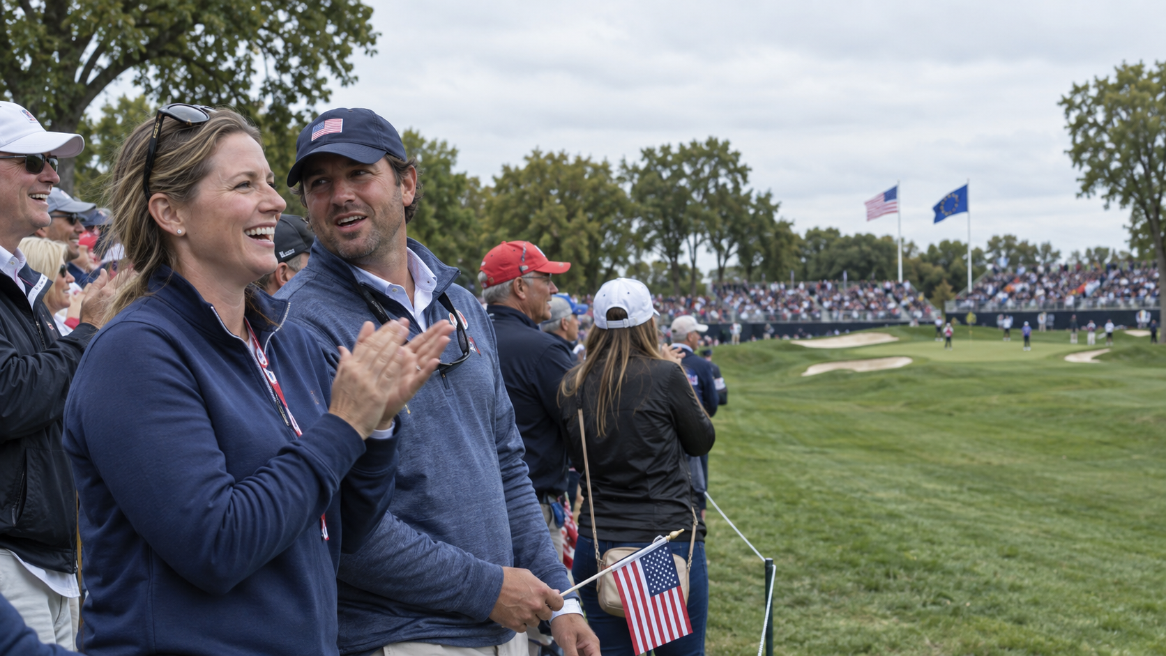 Illustrative Ryder Cup gallery scene with a couple carrying USA flags