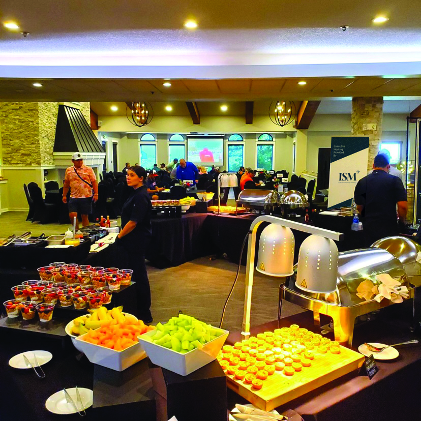 Guests reconnecting during a post-golf luncheon