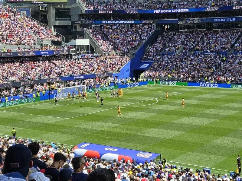 Football match and spectators inside a stadium