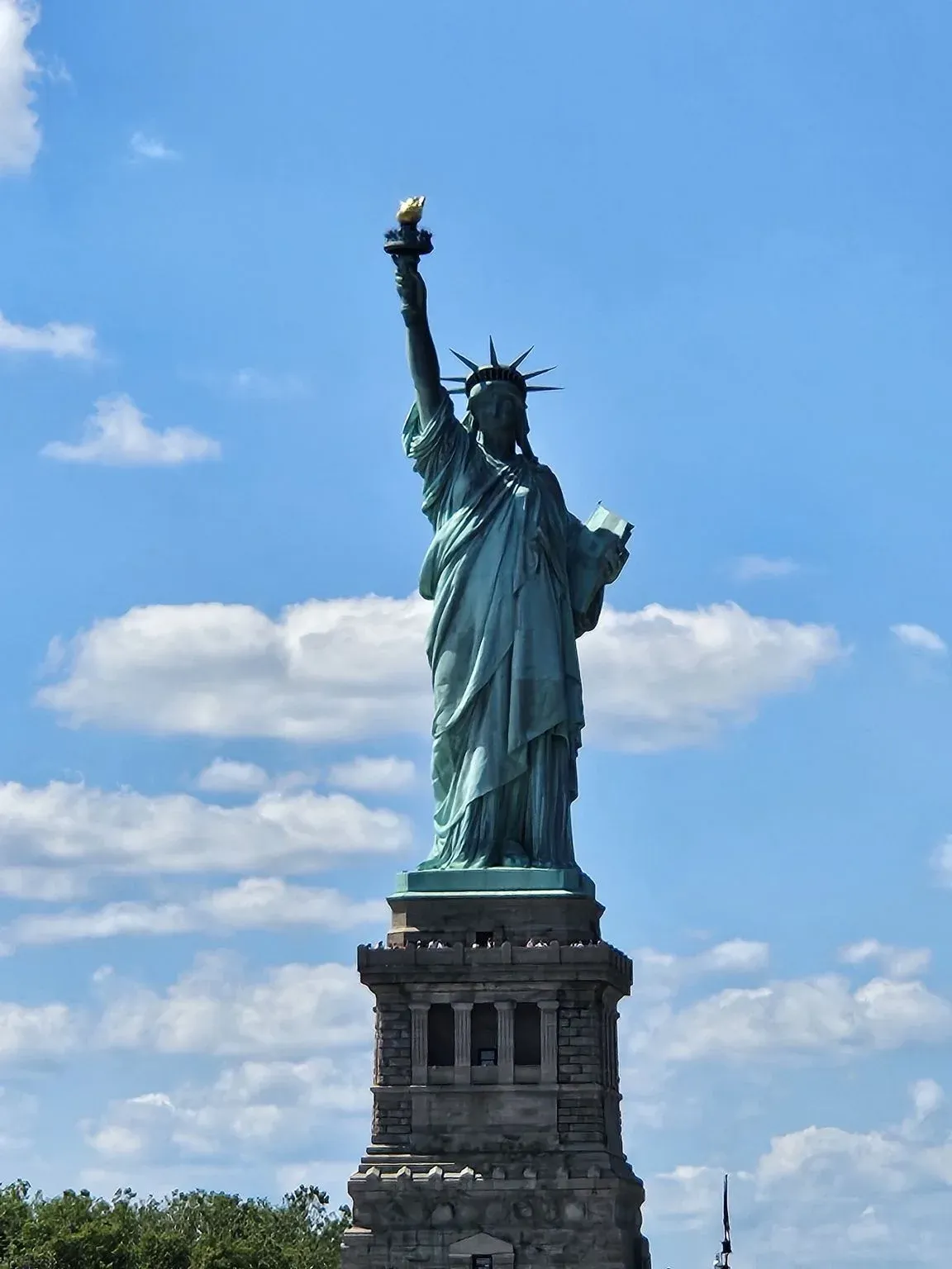 Statue of Liberty against a blue sky