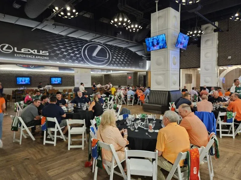 Guests dining in a stadium hospitality area