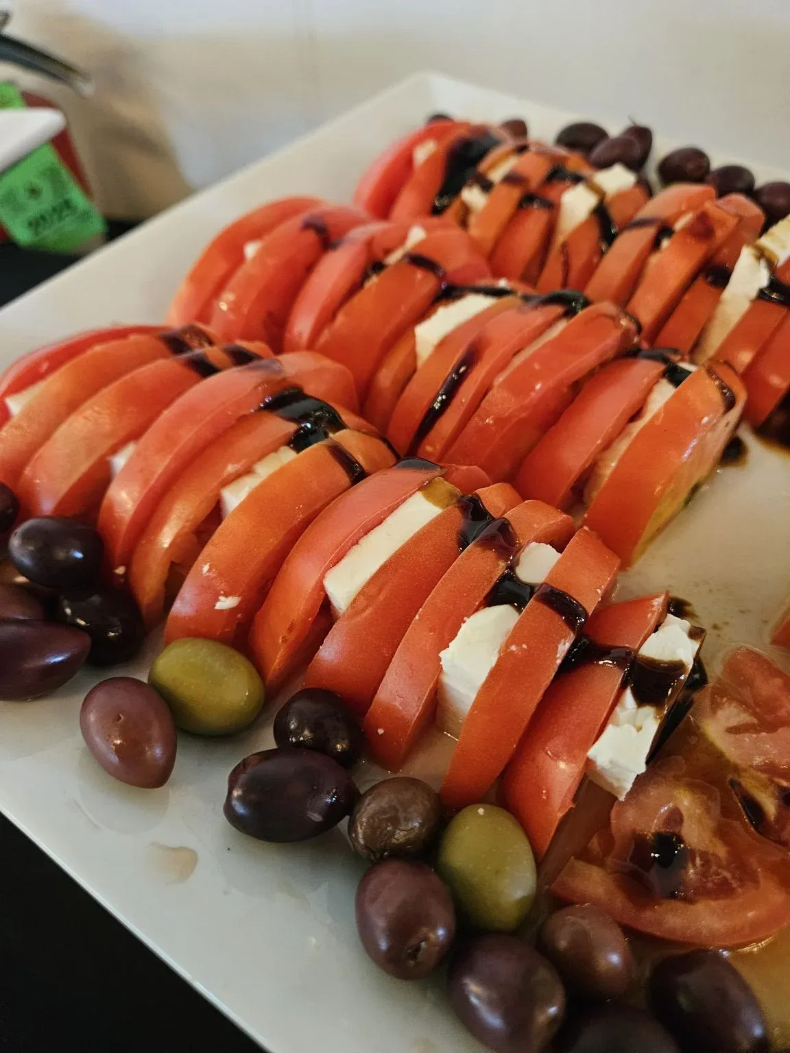 Tomato and mozzarella skewers on a serving platter