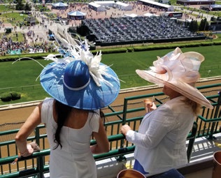 Derby guests overlooking the track from the supplied brochure
